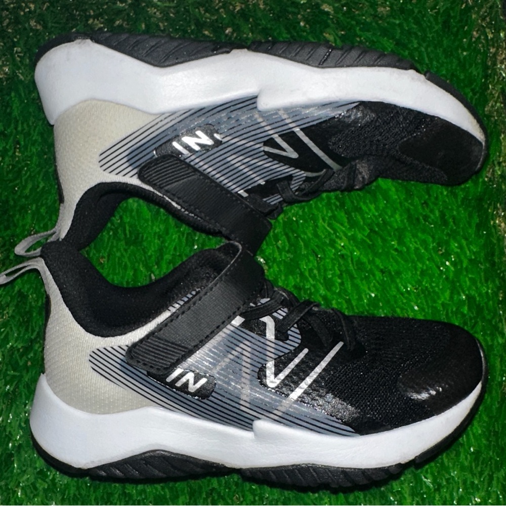 New Balance Kids Sneakers with Gray/Black/White Accents. Great for Baseball Turf